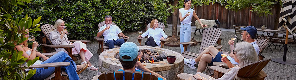 friends relaxing around a firepit