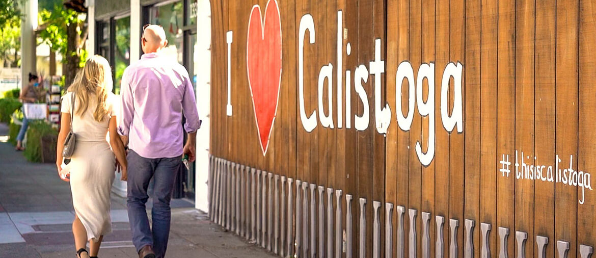 couple walking through town of Calistoga, CA